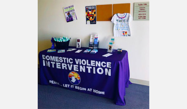 table with domestic violence's souvenirs and brochures
